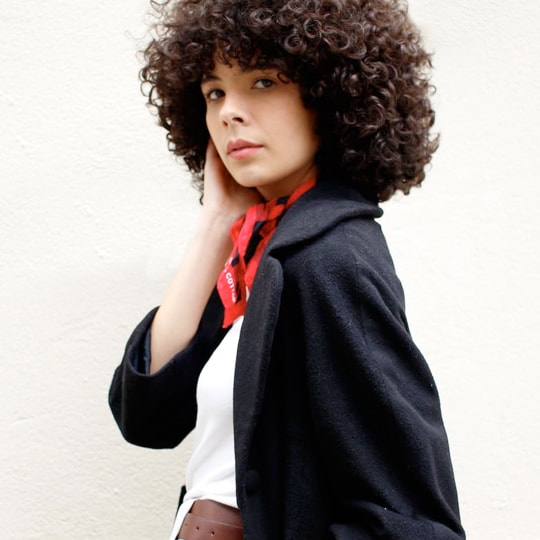 image of a woman with a brown afro